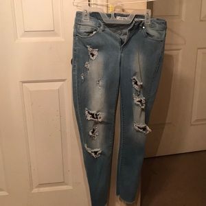 Ripped jeans tight fit .